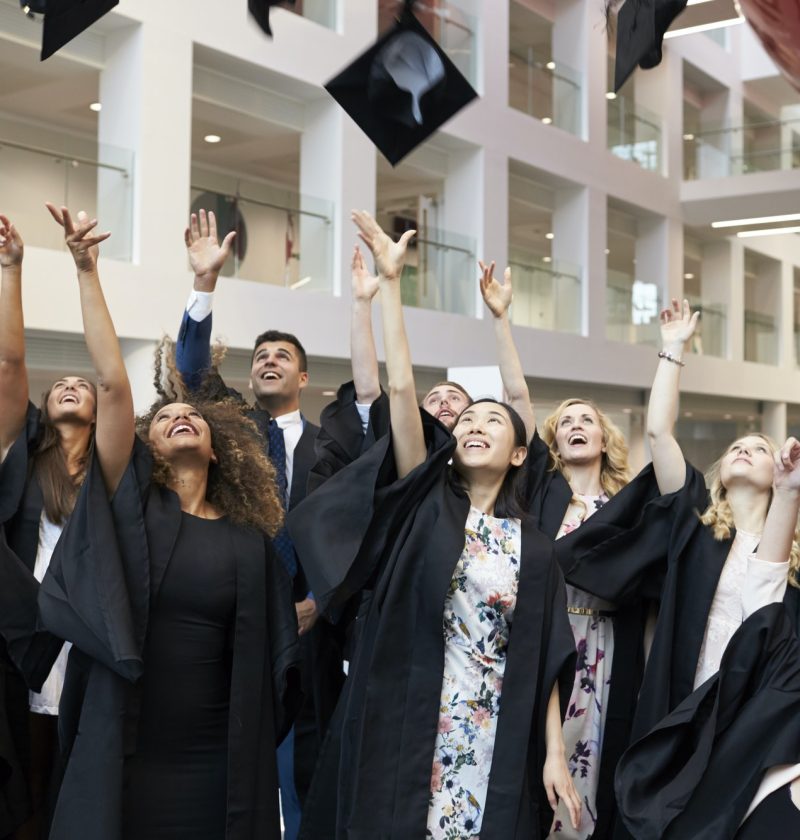 university-students-throwing-their-caps-in-the-air-on-graduation-day.jpg